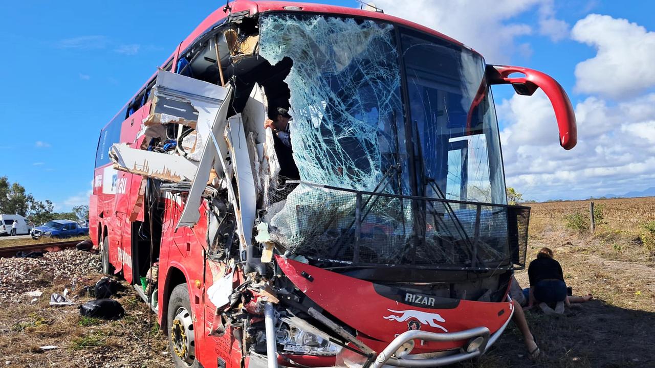 Supplied image from a passenger of a Greyhound bus and caravan crash near Gumlu. The bus driver looking out at the damage after the crash.