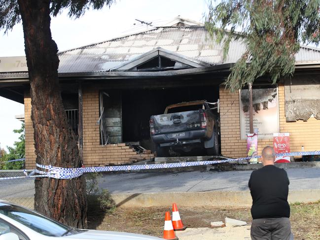 Two men were spotted ramming the Ford Ranger through the front of the milk bar. Picture: David Crosling