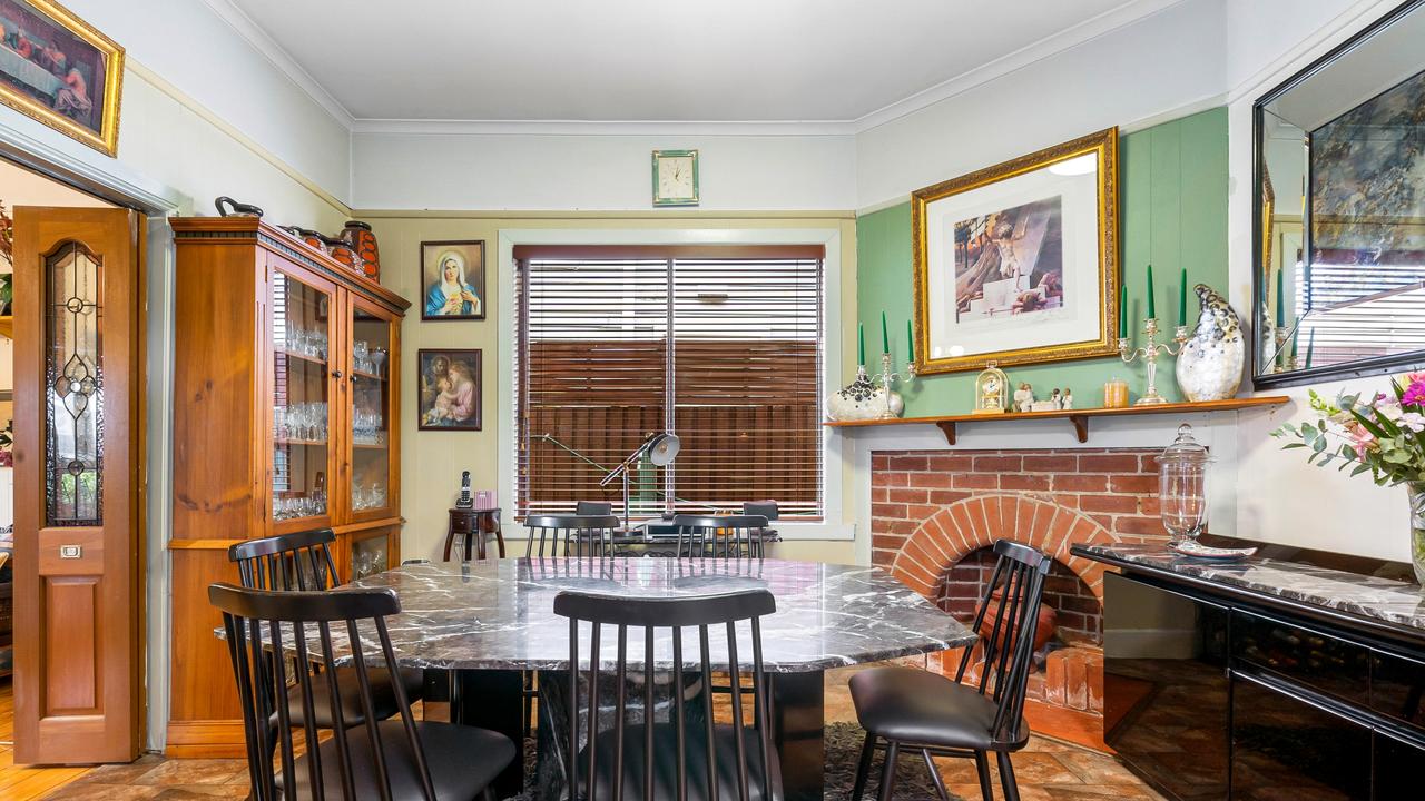 Inside the dining space with a fireplace.