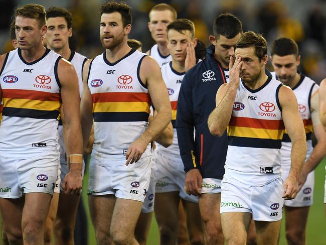 Crows players leave the ground after the Round 13 AFL match between the Hawthorn Hawks and the Adelaide Crows at the MCG in Melbourne, Saturday, June 16, 2018. (AAP Image/Julian Smith) NO ARCHIVING, EDITORIAL USE ONLY