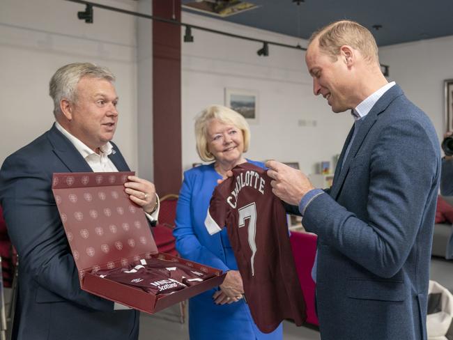 Prince William is presented with Heart of Midlothian football shirts for his children on the second day of his tour of Scotland. Picture: Getty Images.