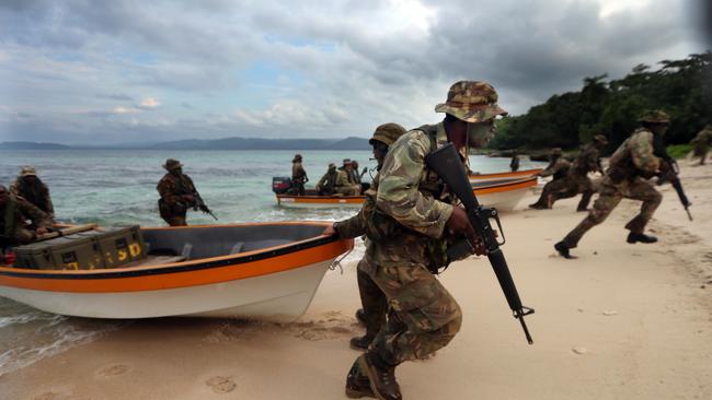 Aussie diggers with PNG soldiers during an exercise in amphibious operations exercise. Picture Gary Ramage