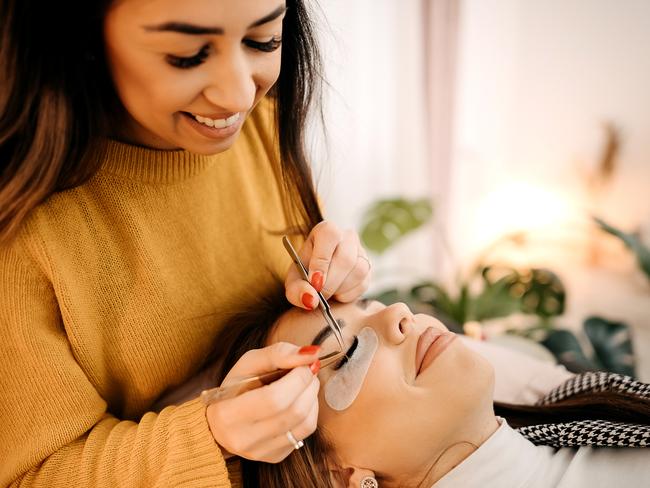 Shot of a young woman getting eyelash extensions