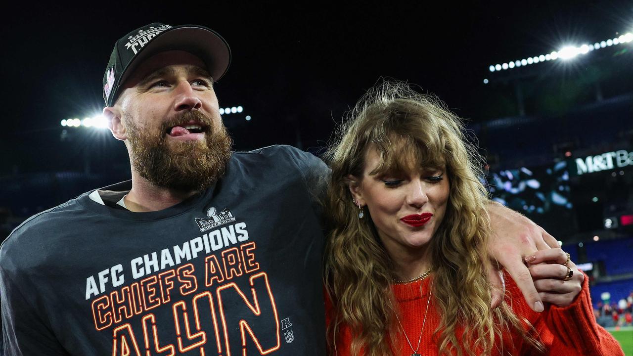 Travis Kelce #87 of the Kansas City Chiefs (L) celebrates with Taylor Swift after defeating the Baltimore Ravens in the AFC Championship Game . Patrick Smith/Getty Images