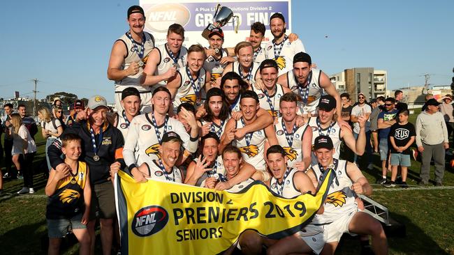 Whittlesea players celebrate with the 2019 NFL Division 2 premiership. Picture: Hamish Blair