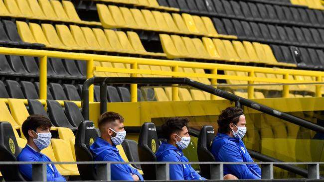 Schalke players sit on the bench during their Bundesliga clash with Borussia Dortmund. Picture: AFP