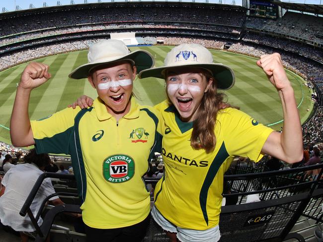 2022 Boxing Day Test MCG. Australia vs South Africa. Crowd colour. Aussie fans Emma Gouws 15 and friend Hilary Roach 15 both play cricket and came dressed with floppy cricket has and zinc cream in honour of Shane Warne.                      Picture: David Caird