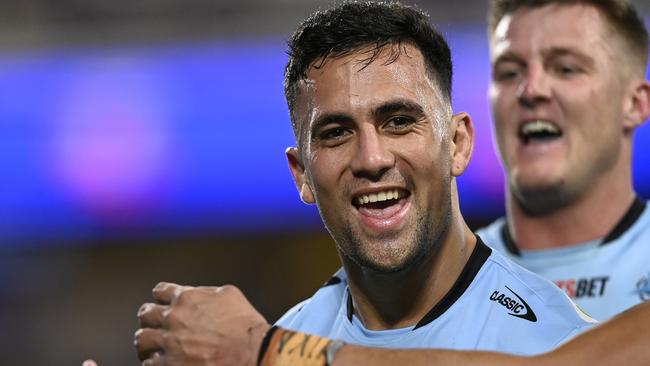 TOWNSVILLE, AUSTRALIA - JULY 27: Kayal Iro of the Sharks celebrates after scoring a try during the round 21 NRL match between North Queensland Cowboys and Cronulla Sharks at Qld Country Bank Stadium, on July 27, 2024, in Townsville, Australia. (Photo by Ian Hitchcock/Getty Images)