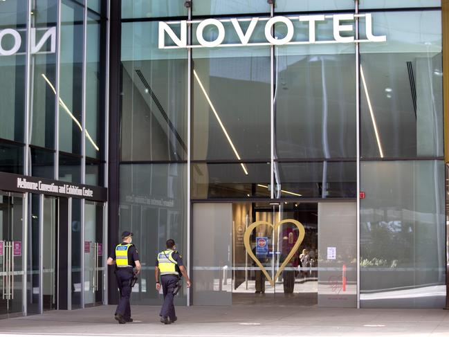 MELBOURNE, AUSTRALIA - NewsWire Photos December 13 2020: Police at the Novotel Hotel in South Wharf on Sunday morning. The Novotel is one of the hotspot  hotels designated for quarantining positive Covid cases in Melbourne. Picture: NCA NewsWire / David Geraghty