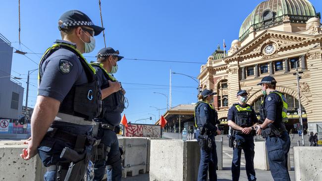 Police officers patrol the CBD during Melbourne's 6th COVID lockdown. Picture: NCA NewsWire / David Geraghty