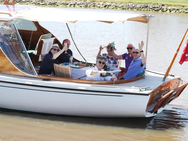 Milton Green celebrated with friends aboard his boat on Maribyrnong river. NCA NewsWire / David Crosling