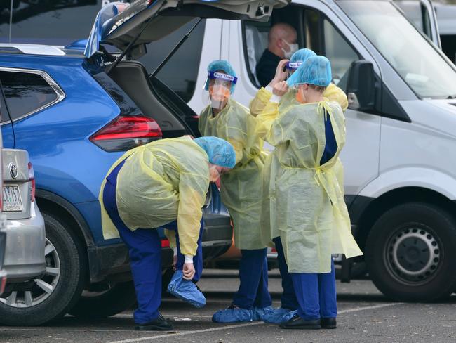 Staff get into PPE outside St Basil’s. Picture: Nicki Connolly