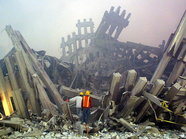 Rescue workers survey damage to the World Trade Center. Picture: Doug Kanter