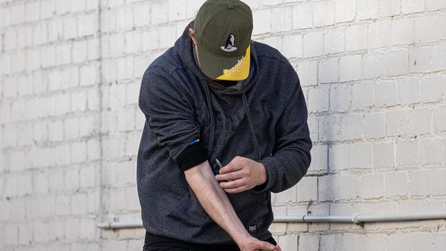 A drug user injecting in the streets of Richmond. Picture: Jason Edwards