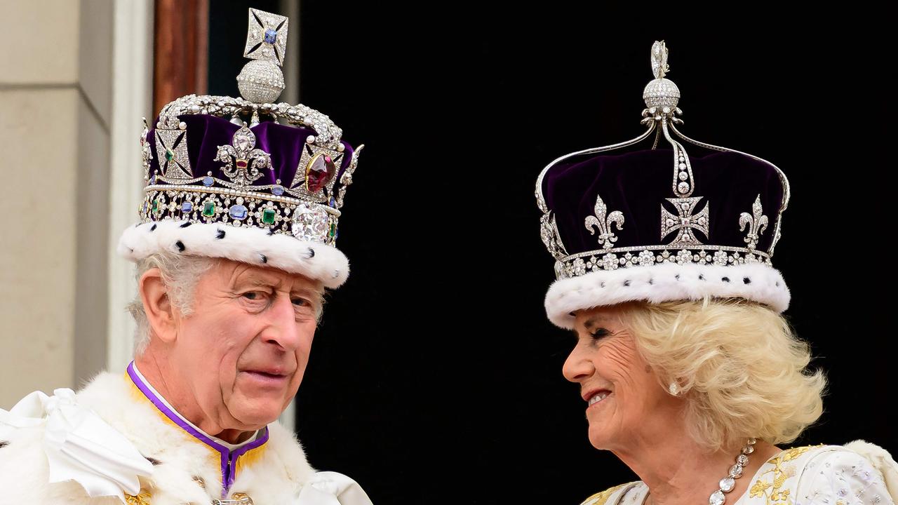 TOPSHOT - Britain's King Charles III and Queen Camilla stand on the Buckingham Palace balcony, in London, following their coronations, on May 6, 2023. - The set-piece coronation is the first in Britain in 70 years, and only the second in history to be televised. Charles will be the 40th reigning monarch to be crowned at the central London church since King William I in 1066. Outside the UK, he is also king of 14 other Commonwealth countries, including Australia, Canada and New Zealand. Camilla, his second wife, will be crowned queen alongside him, and be known as Queen Camilla after the ceremony. (Photo by Leon Neal / POOL / AFP)
