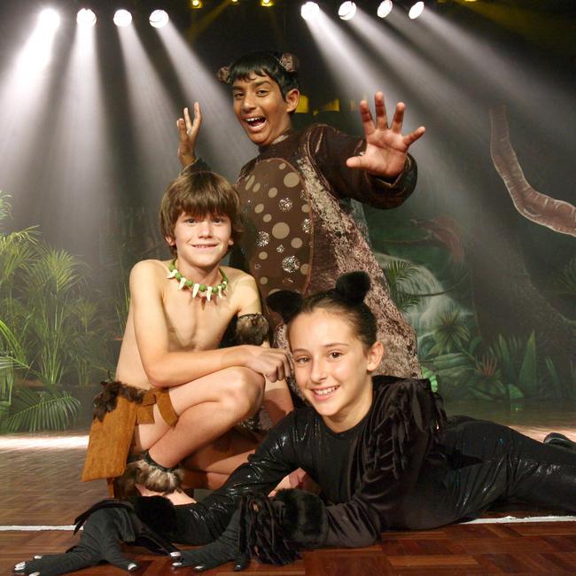 Mowgli played by Robert Medland 12 (bare chest), Baloo played by Sherwyn Dutt 12 (brown suit) and Bagheera played by Olivia Layani 12 (black).