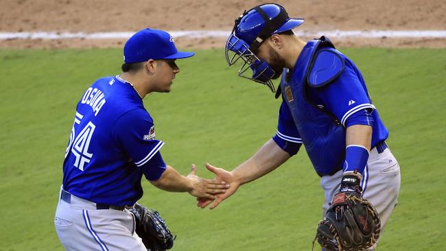 New Jays catcher Russell Martin confident handling R.A. Dickey's