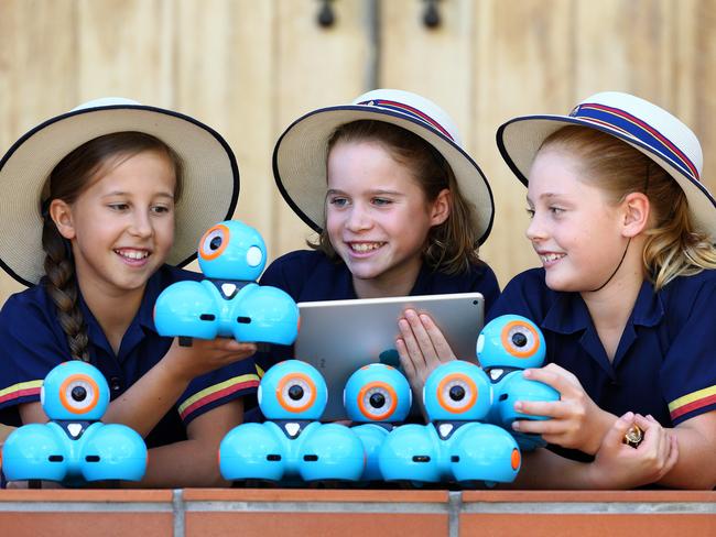 Elysse Tapper. 10, nine-year-old Alexi McCarthy and Sienna Hopkinson, 10, are among students at St Hilda's School in Southport learning to code through Swift Playground. Picture: Adam Head