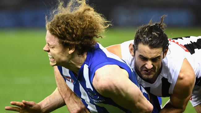 Brodie Grundy tackles Ben Brown. (Photo by Quinn Rooney/Getty Images)