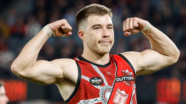 MELBOURNE, AUSTRALIA - MAY 19: Zach Merrett of the Bombers celebrates a goal during the 2024 AFL Round 10 match between the Essendon Bombers and the North Melbourne Kangaroos at Marvel Stadium on May 19, 2024 in Melbourne, Australia. (Photo by Dylan Burns/AFL Photos via Getty Images)