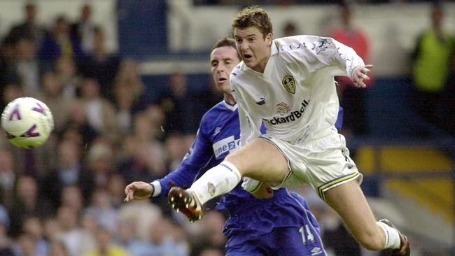 Bridges is airborne as he fires home a goal for Leeds against Everton in 2000. Picture: AP