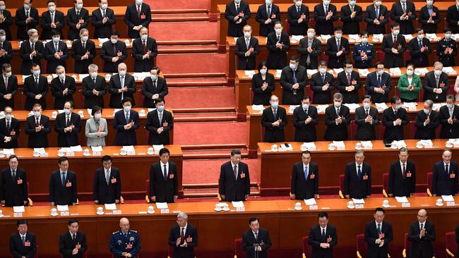 Xi Jinping, centre, attends the second plenary session of the National People's Congress (NPC), with Chinese leaders and delegates, at the Great Hall of the People, in Beijing. Admission of failure would badly delegitimise Mr. Xi’s carefully constructed hero-cult. Picture: AFP