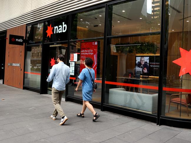 SYDNEY, AUSTRALIA - MARCH 27: Pedestrians walk past National Australia Bank Ltd. branch at Barangaroo on March 27, 2024 in Sydney, Australia. In the last quarter, Westpac Bank reported a quarterly cash profit of A$1.8 billion, meeting consensus expectations, while NAB experienced a 17% decline in first-quarter cash profit compared to the previous corresponding period, reflecting varying performances among the major Australian banks. (Photo by Brendon Thorne/Getty Images) (Photo by Brendon Thorne/Getty Images)