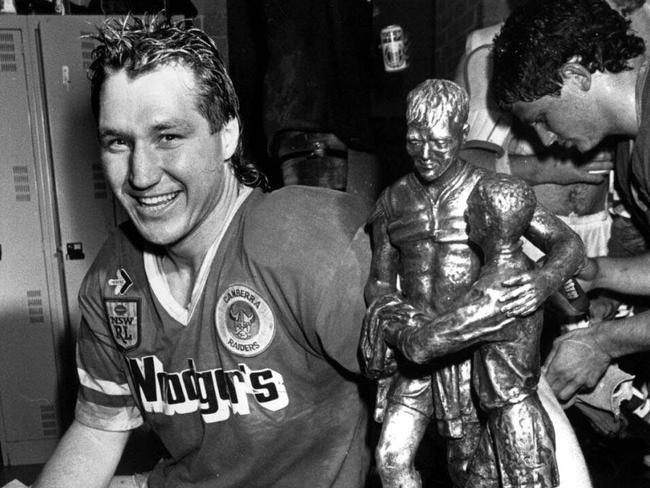 Canberra hero Steve Jackson with the premiership trophy after the 1989 grand final.