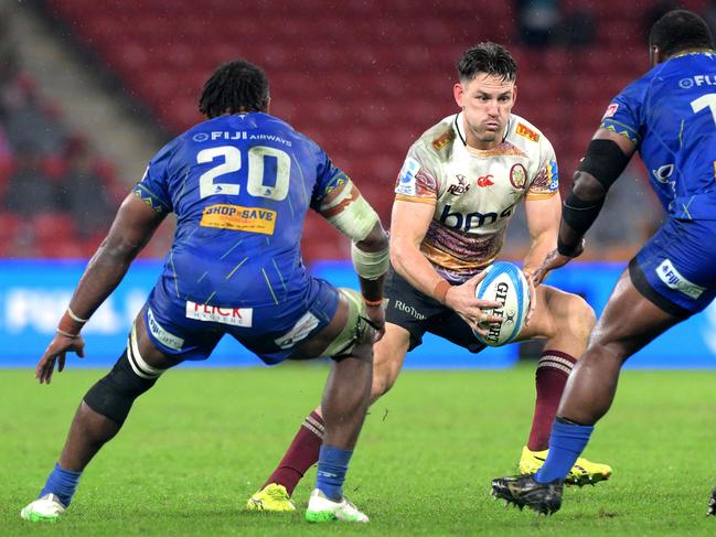 BRISBANE, AUSTRALIA - MAY 31: Lachie Anderson of the Reds looks to take on the defence during the round 16 Super Rugby Pacific match between Queensland Reds and Fijian Drua at Suncorp Stadium, on May 31, 2025, in Brisbane, Australia. (Photo by Bradley Kanaris/Getty Images)
