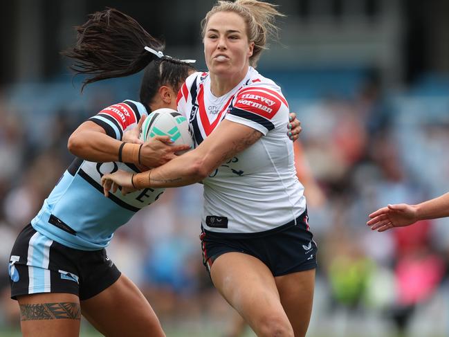 SYDNEY, AUSTRALIA - SEPTEMBER 08: Isabelle Kelly of the Roosters is tackled during the round seven NRLW match between Cronulla Sharks and Sydney Roosters at PointsBet Stadium on September 08, 2024 in Sydney, Australia. (Photo by Mark Metcalfe/Getty Images)