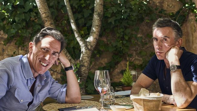 Rob Brydon and Steve Coogan take a breather between main courses of cuisine and comedy. Hard work, but someone’s gotta do it.