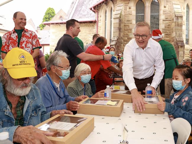 Prime Minister Anthony Albanese serving lunch on Christmas Day at The Rev. Bill Crews Foundation in Ashfield. The foundation served a free lunch to 4,000 poor and hungry Sydneysiders. Picture: Justin Lloyd