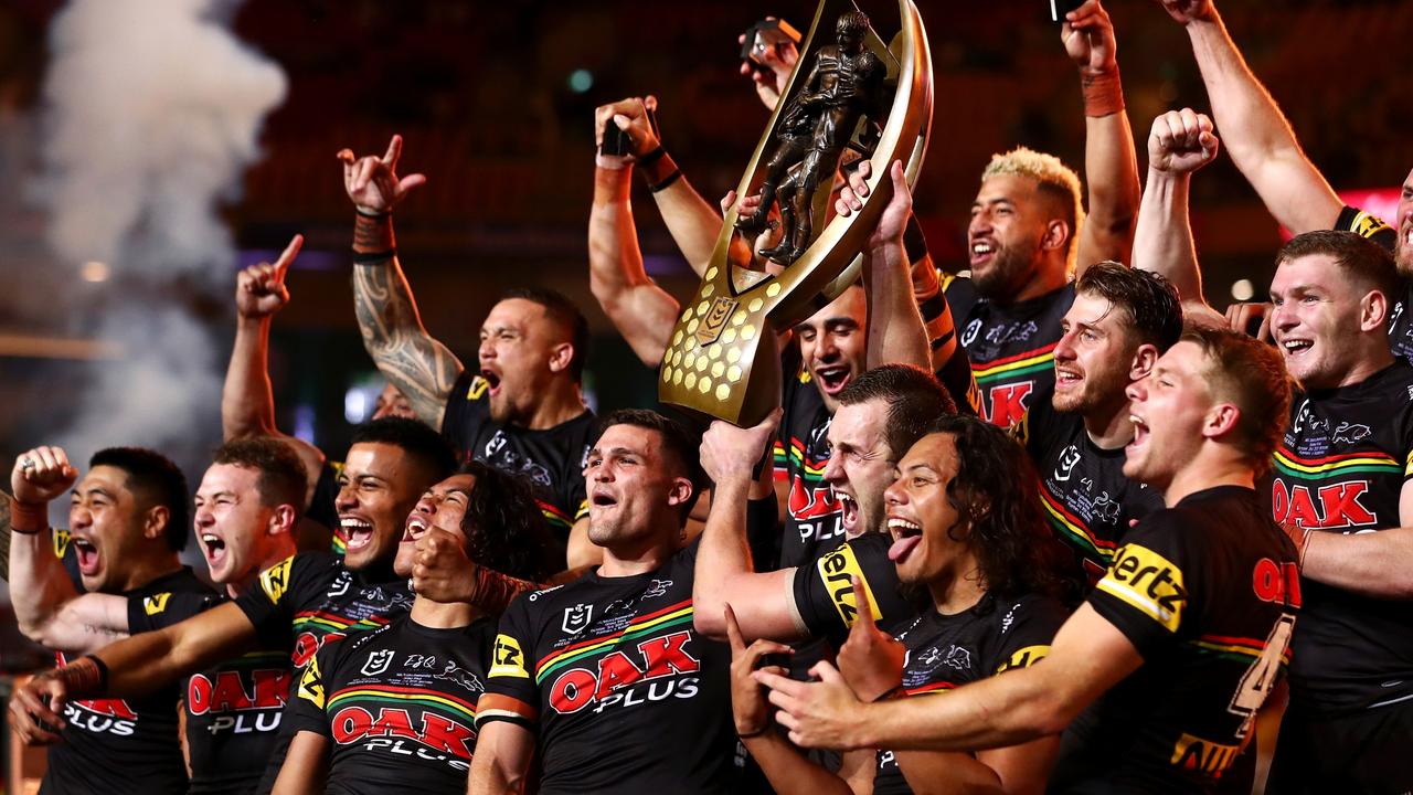 BRISBANE, AUSTRALIA - OCTOBER 03: The Panthers celebrate with the NRL Premiership Trophy after victory in the 2021 NRL Grand Final match between the Penrith Panthers and the South Sydney Rabbitohs at Suncorp Stadium on October 03, 2021, in Brisbane, Australia. (Photo by Chris Hyde/Getty Images)