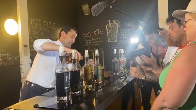 Queensland Opposition Leader David Crisafulli gets behind the bar