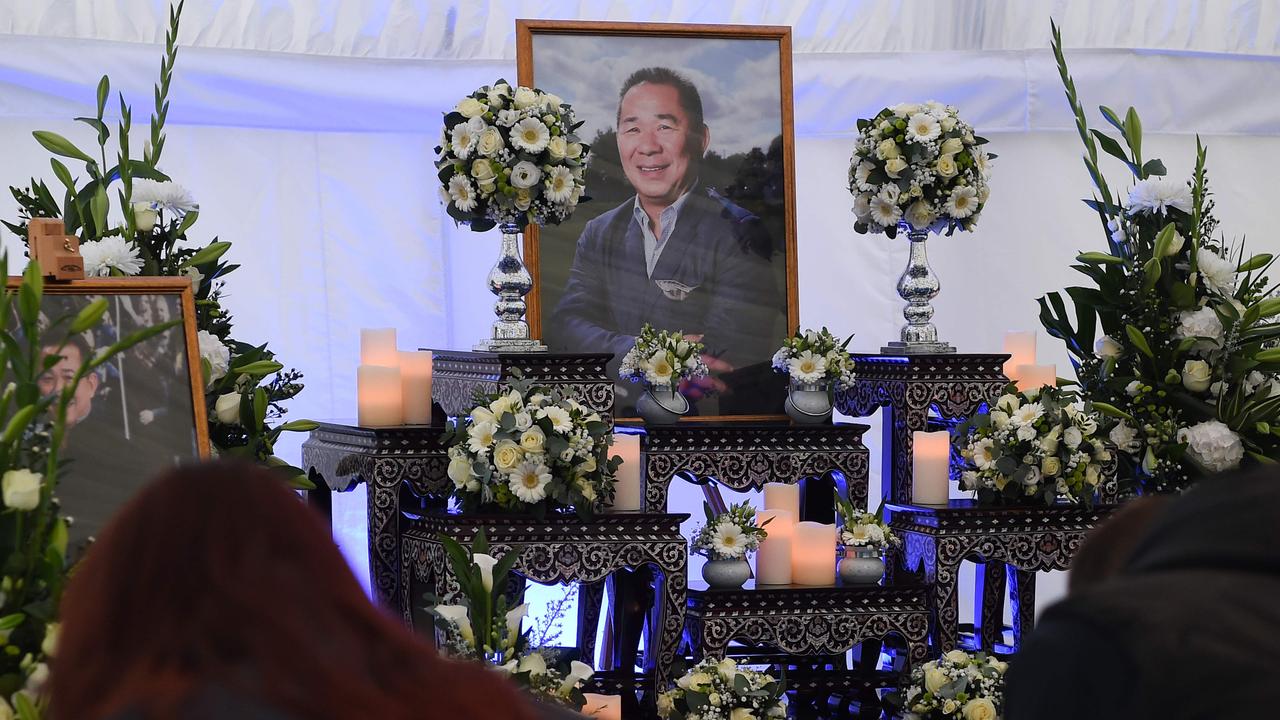 People sign a book of condolence for Vichai Srivaddhanaprabha. Picture: AFP.