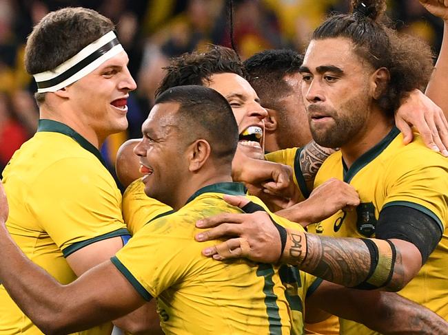 Kurtley Beale of the Wallabies (centre) celebrates with team mates after scoring a try during the Bledisloe Cup match between the Australian Wallabies and the New Zealand All Blacks at Optus Stadium in Perth, Saturday, August 10, 2019.  (AAP Image/Dave Hunt) NO ARCHIVING, EDITORIAL USE ONLY