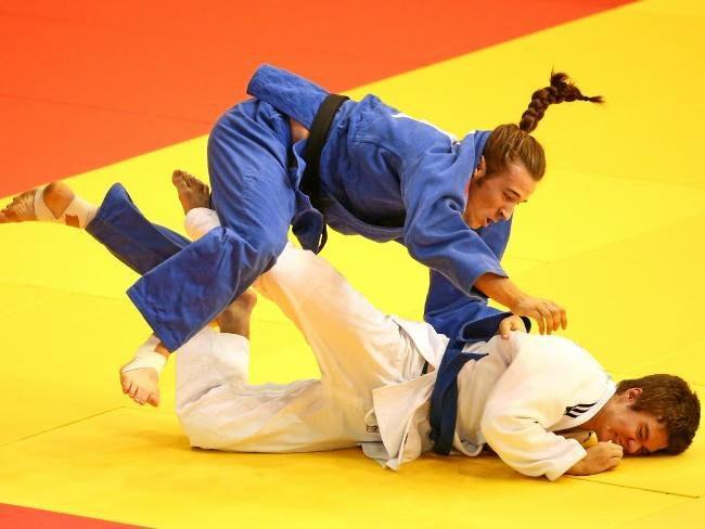 Australian Connor Smith (white) competes against Thomas Lish of England in the boys -90kg judo at the 2017 Youth Commonwealth Games.