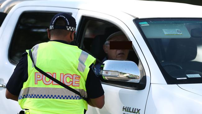 Cairns police officers patrol near the intersection of Shields Street and Sheridan Street, booking drivers for speeding and using mobile phones while driving. A driver is fined for exceeding the 40 kilometre per hour speed limit. PICTURE: BRENDAN RADKE