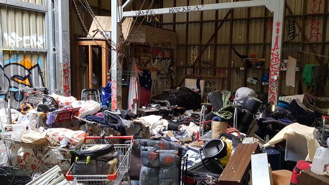 Rubbish and trolleys inside abandoned shed on Maroondah Highway, Ringwood.