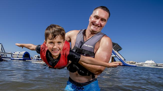 Matt Pryer holding Nate Pryer, 5, at the GC Aqua Park, Southport. Picture: Jerad Williams