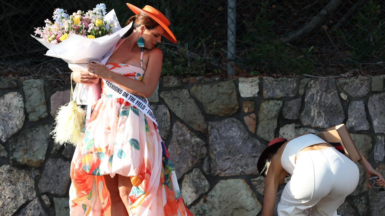 Punters leave Eagle Farm racecourse on Melbourne Cup Day.