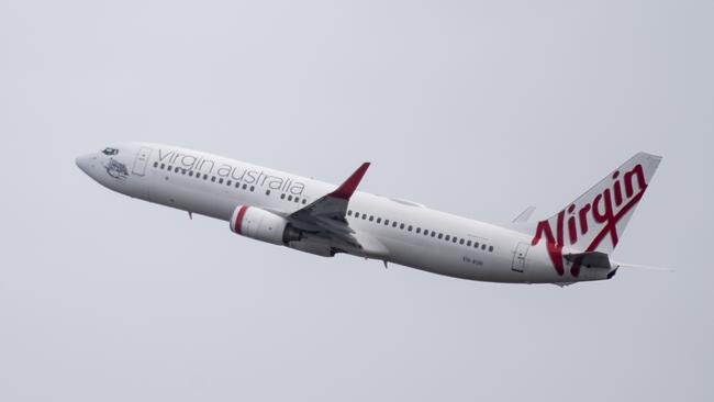SYDNEY, AUSTRALIA - NewsWire Photos May 6, 2021: A Virgin Australia aircraft taking off at Sydney Airport.Picture: NCA NewsWire / James Gourley
