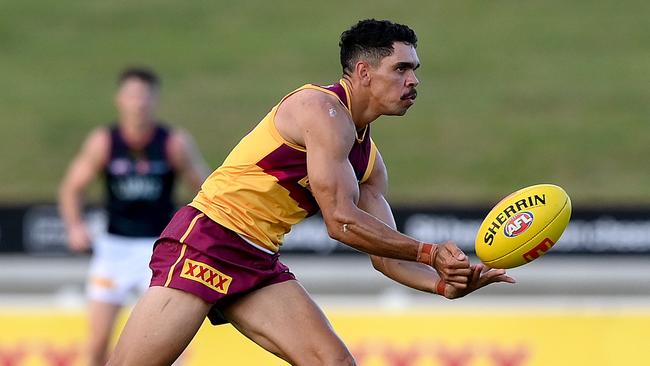 Charlie Cameron dishes off a handball. Picture: Bradley Kanaris/Getty Images