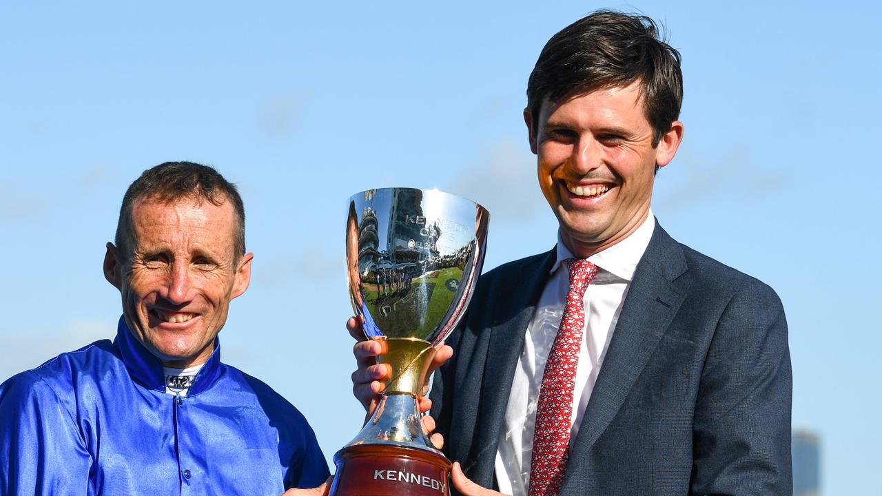 James Cummings (right) capped a big spring carnival when Willowy won the VRC Oaks and celebrates with jockey Damien Oliver. Picture: Getty Images