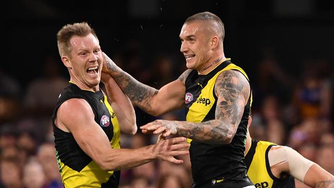 Dustin Martin celebrates one of his six goals with Jack Riewoldt. Picture: AAP