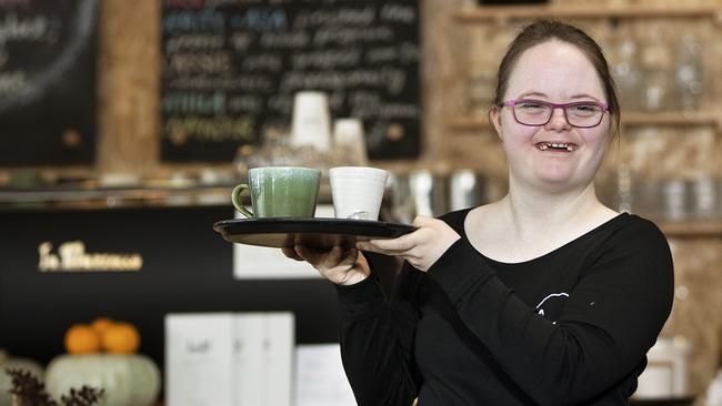 Alex Morris-Baguley offers service with a smile at the Hamlet Cafe at Hobart. Picture: CHRIS KIDD