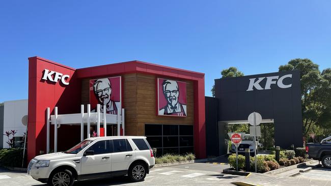 Vehicles exit the Victoria Point KFC at lunch time. Picture: Marcel Baum