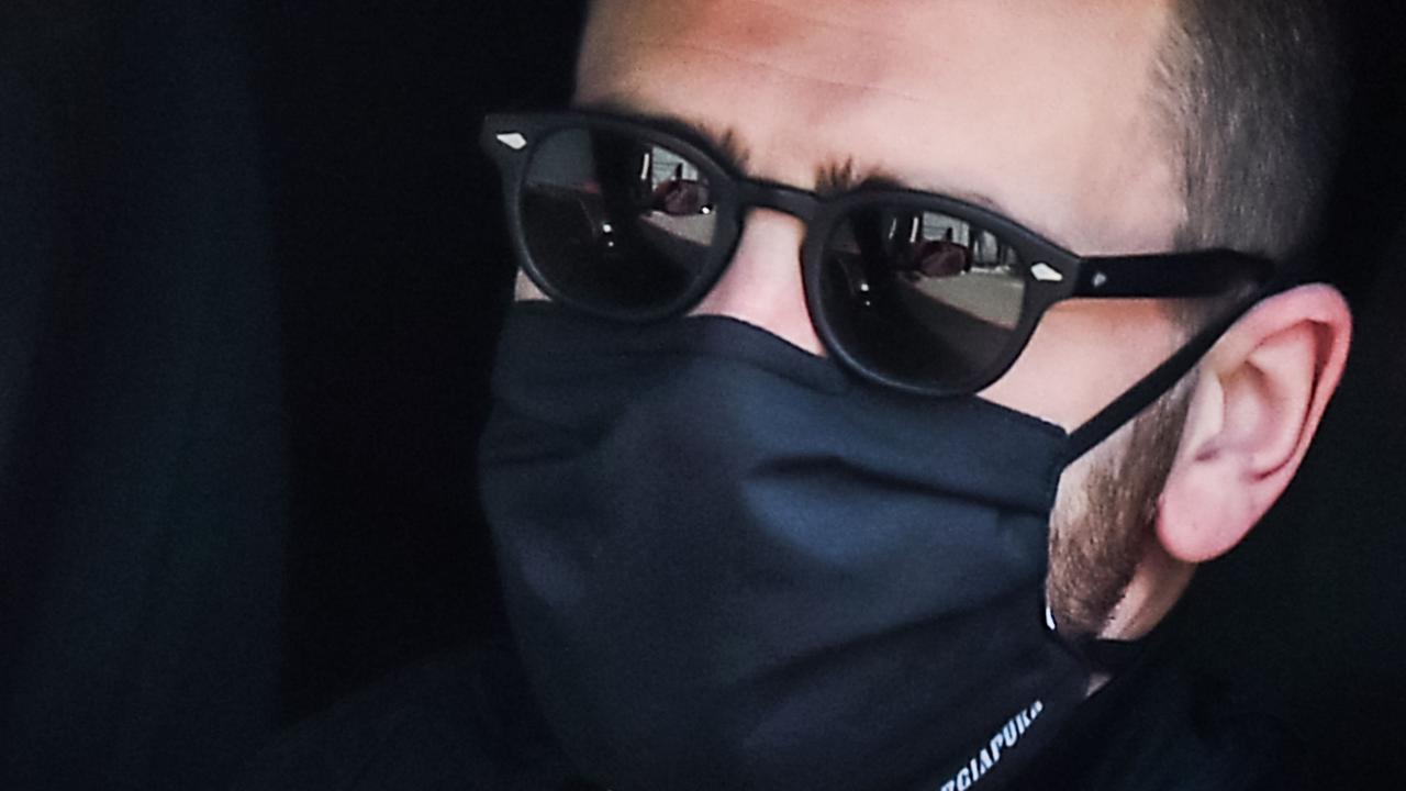 Juventus' Italian defender Leonardo Bonucci, wearing a face mask, arrives in his car at the Juventus' Continassa training ground in Turin.