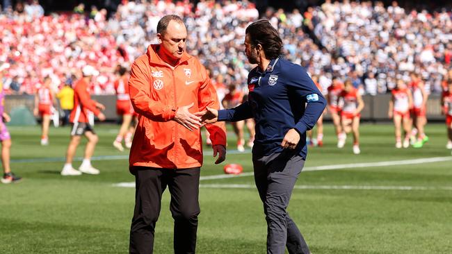 John Longmire shakes hands with Chris Scott before last year’s Grand Final. Picture: Mark Stewart