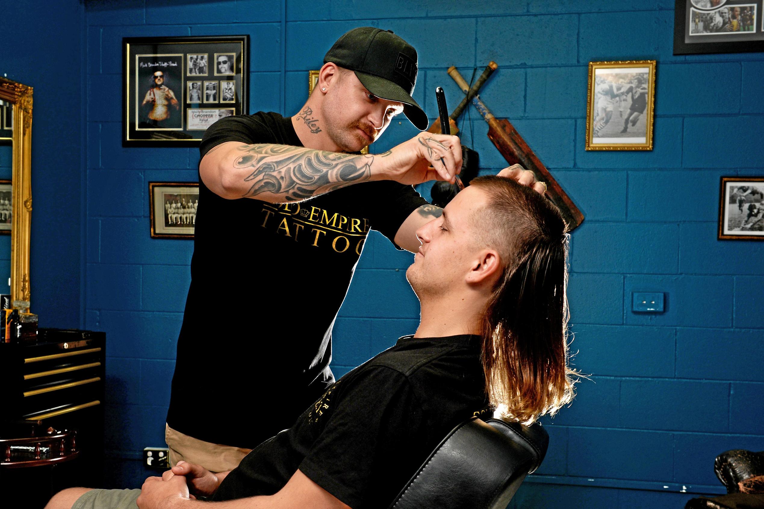 The Mullet is making a comeback in Mackay. Jai Gurr getting his Mullet styled by Andrew Folwell at Gold Empire Tattoo and Hair in Mackay. Picture: Stuart Quinn